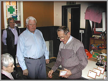 Martin presents Ron Newell with an award