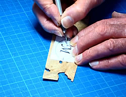 Cutting a letter M